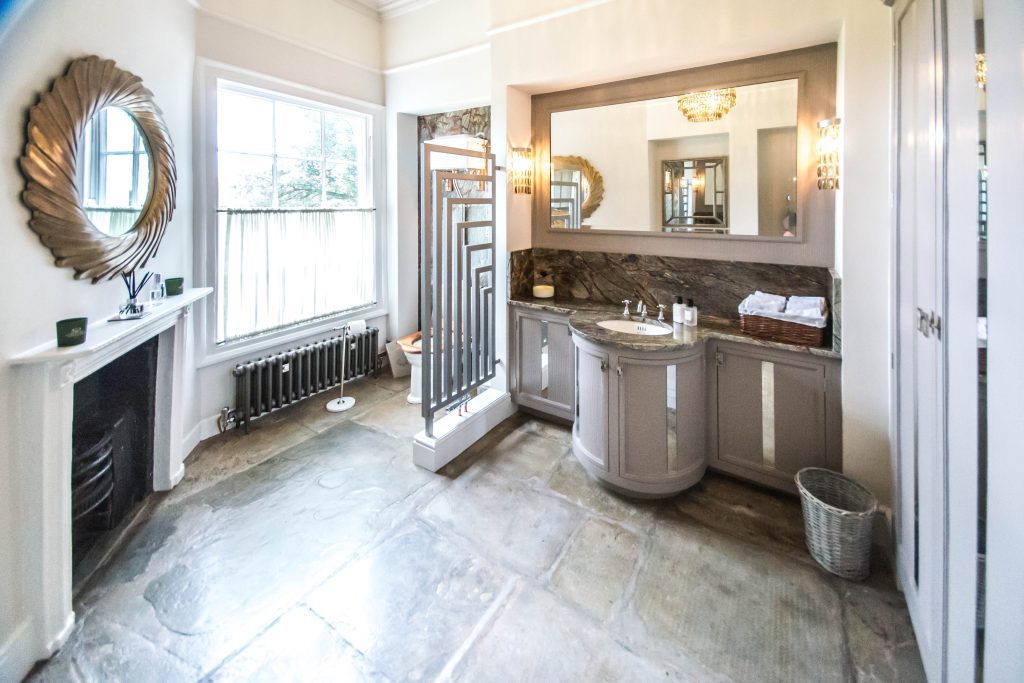 Bathroom with curved vanity unit