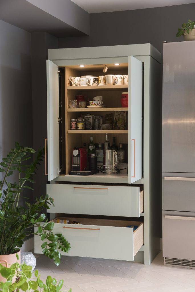 Larder unit with pocket doors