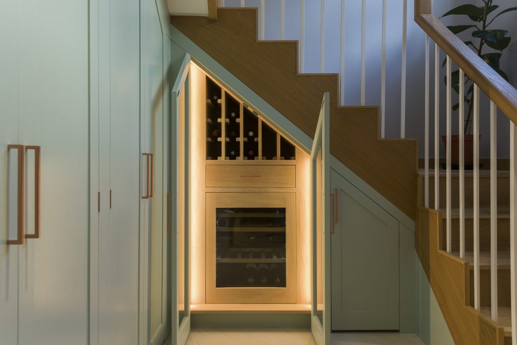 Wine storage area with wine fridge and drawer above