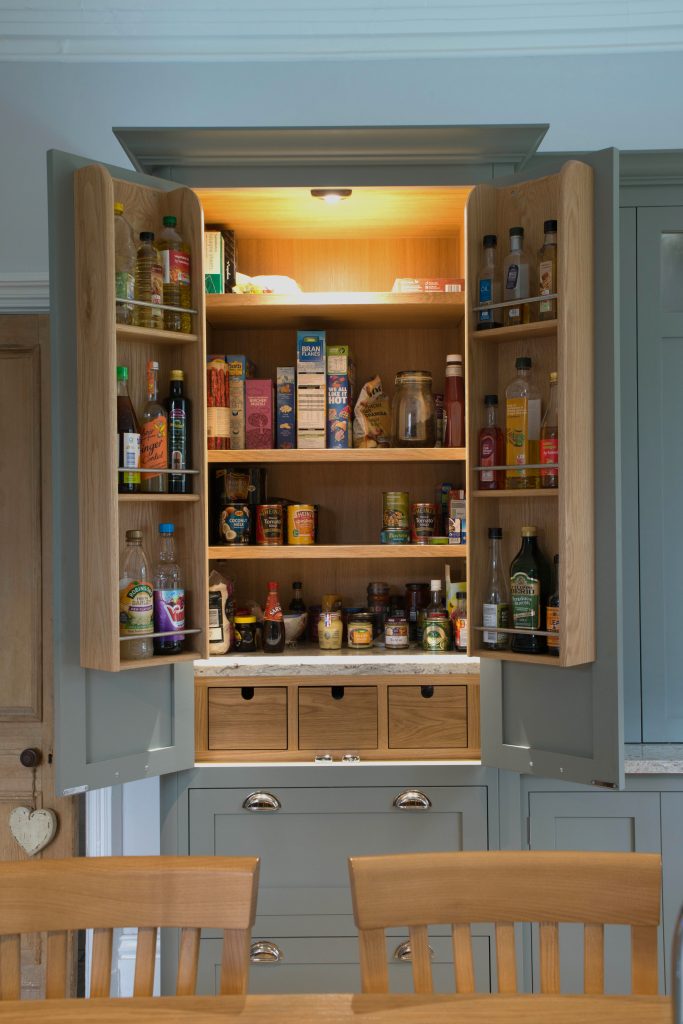 Larder unit with oak bottle rack and oak drawers