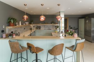 Contemporary Kitchen with solid oak worktop seating area