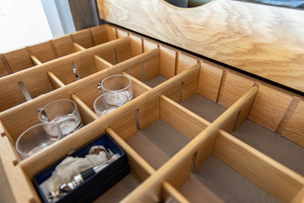 Pull out drawer with adjustable dividers and faux ostrich base