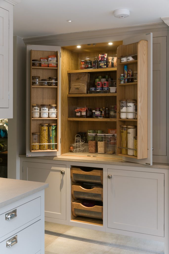 Larder with bottle racks behind doors