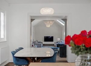 Dinning area looks onto a living room