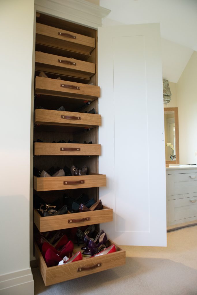 Pull out shoe trays with leather strap handles